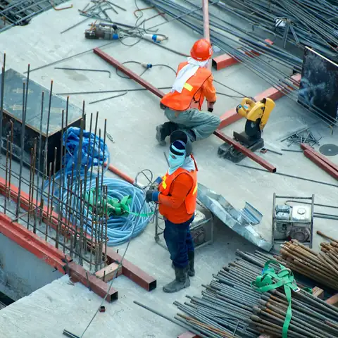 Workers on a construction site seen from above